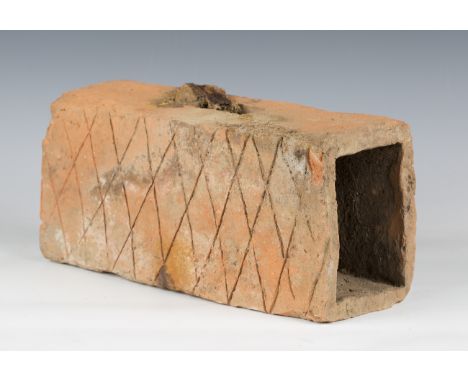 An ancient Roman terracotta flue brick with incised crosshatching to two sides, length 35cm.Buyer’s Premium 29.4% (including 