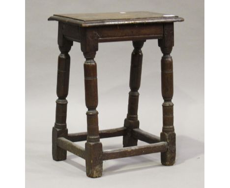 A 17th century oak joint stool, raised on turned and block legs, height 54cm, width 41cm, depth 25.5cm (alterations and resto