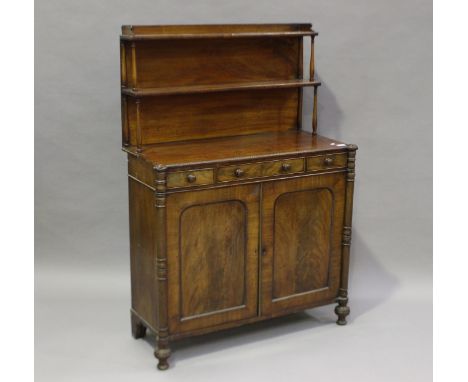 A William IV figured mahogany chiffonier with egg and dart mouldings, the shelf back above three short drawers and two arched