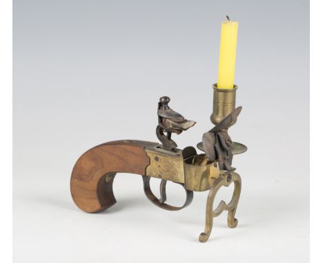 A 20th century Italian pistol tinder lighter with wooden handle and candle socket, length 13cm.Buyer’s Premium 29.4% (includi