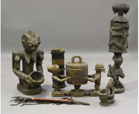An African carved softwood fertility figure of a kneeling female holding a bowl, height 66cm, together with a figural jar and