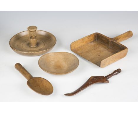 A group of mainly 19th century treen kitchenalia, including a grain scoop, various spoons, a nutcracker and a cuckoo caller.B
