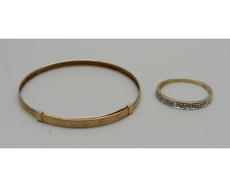 A 9ct gold hallmarked baby's bangle, 1.2g and a 9ct gold and diamond ring, 1.1g, N 