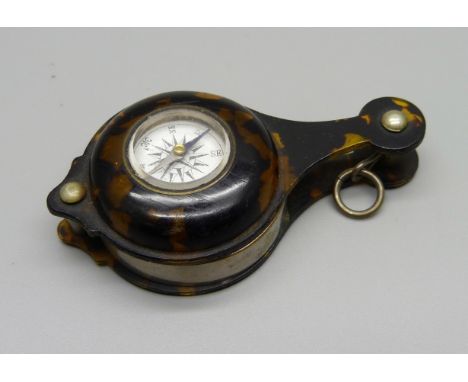 A tortoiseshell eyeglass with compass, optic a/f 