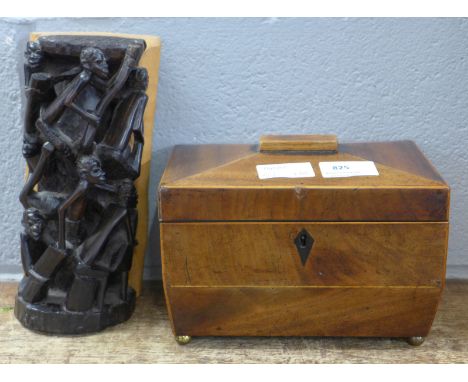 A wooden tea caddy and an African wooden sculpture 