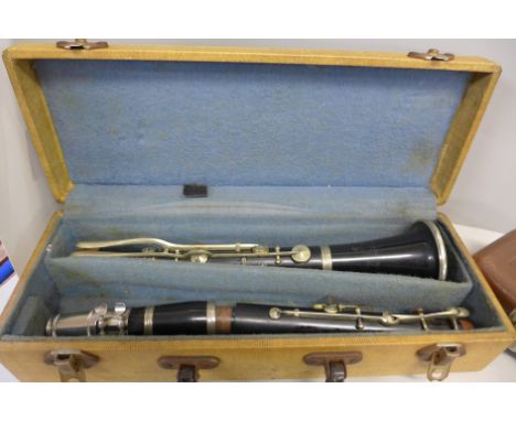 A flute, T.E. Olds &amp; Son and a clarinet (made of different branded parts) 