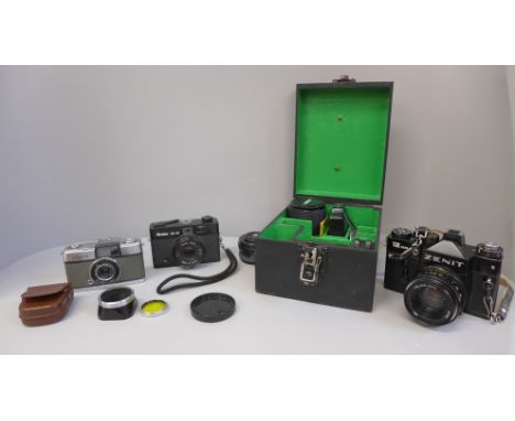 A Zenit 12 x 8 film camera, lens, additional lens and flash, a Rollei XF35 camera and an Olympus-Pen camera 