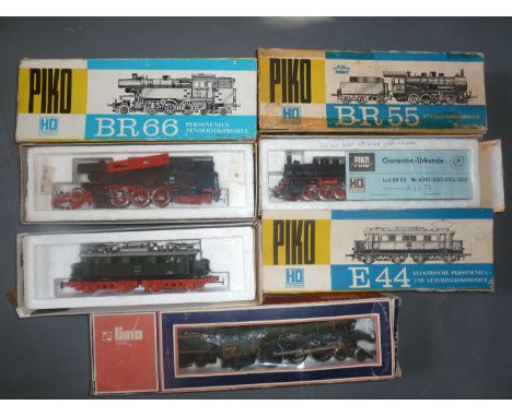 A boxed Piko HO BR 55 locomotive, a boxed Piko HO BR 66 locomotive, a Piko HO E44 locomotive and a boxed Lima 4-6-2 "Sir Fred
