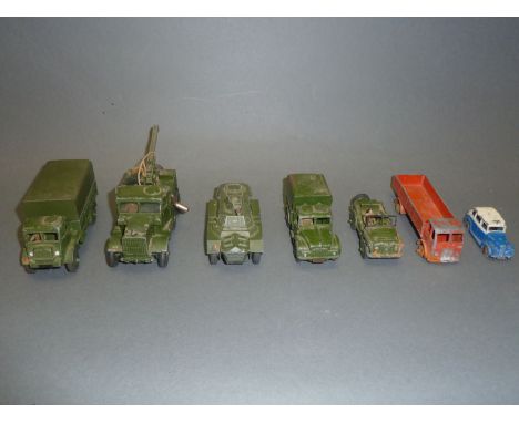 A small box of Dinky diecast toys, predominately army vehicles : recovery tractor (661) army wagon (623), etc