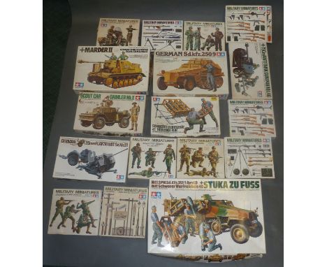 A collection of boxed Tamiya 1/35 scale military model kits 