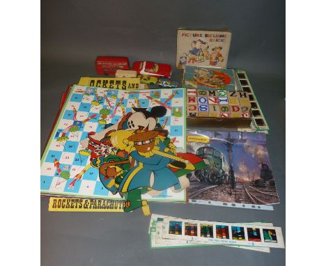 A collection of vintage board games (boards only), building blocks, Chad Valley colour slides, diecast vehicles etc