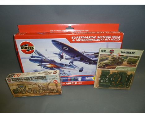 A Airfix 1-72 scale plastic model kit, Supermarine Spitfire MkIX and Messerschmitt BF10C/D, Airfix 00 scale Bofors gun and tr