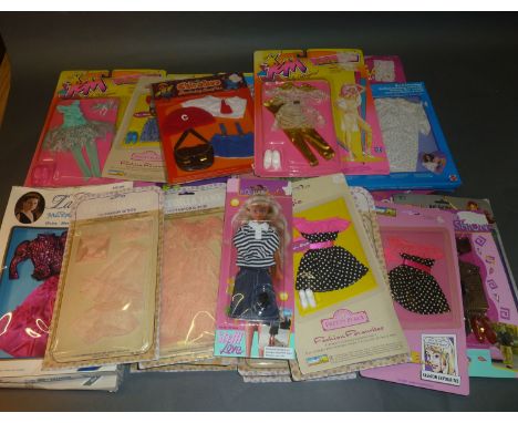 A quantity of boxed dolls clothing and outfits including Chad Valley, Victoria Jane, Suzie and Jordache