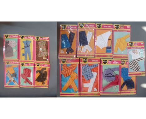 A collection of boxed Sindy dolls outfits: Mix and Match Blouse and T-Shirt, Jacket & Sweater, Yellow Jacket, Top and Bag, Tr