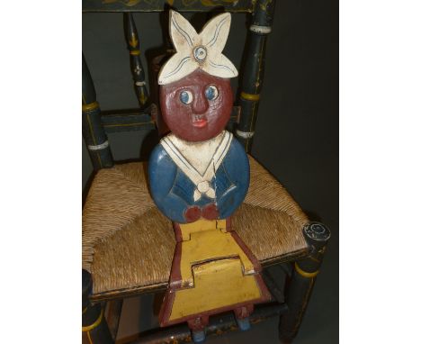 A wooden painted shelf doll