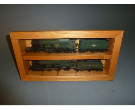 2 cased 00 gauge locomotives and tenders: a Hornby Swindon 7037 locomotive and tender and a Lima King George V 6000 locomotiv