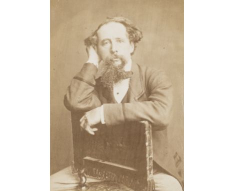 Dickens (Charles).- Portrait of Dickens seated and leaning on the back of a chair, [by Herbert Watkins], albumen print, sligh