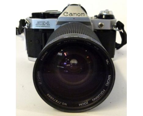 Canon AE-1 film camera together with Vivitar 28-200mm lens