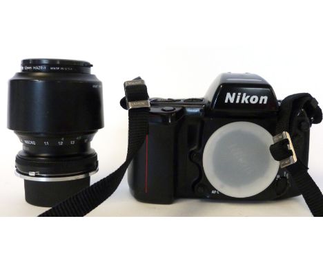 Nikon F90 film camera, together with Tamron 70-210mm lens