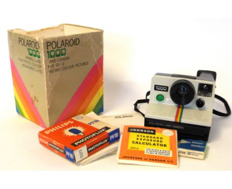 Polaroid Land Camera 1000 plus manual and a Philips Photoflux PF1B