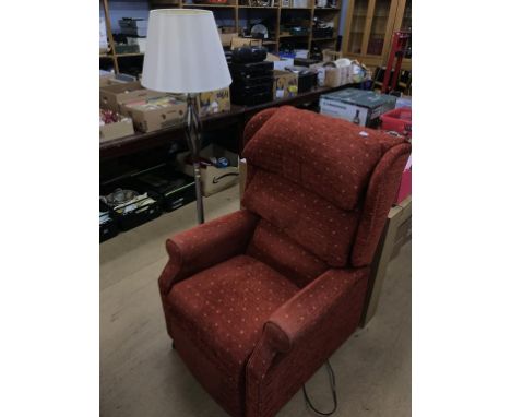 A recliner armchair and standard lamp