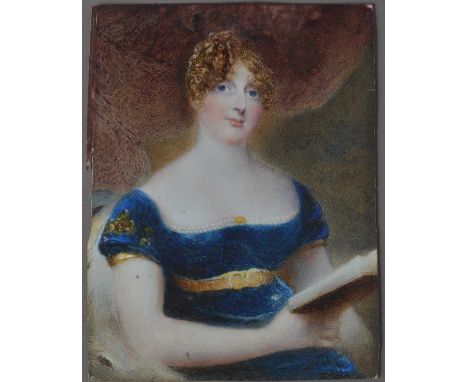A mid 19th century Portrait miniature on Ivory of a lady reading, rectangular in a brass frame, writing to verso dating the w