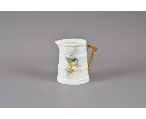 A small Royal Worcester porcelain jug, hand painted Blue tit design, signed H. Powell, printed mark to the underside, 7cm hig