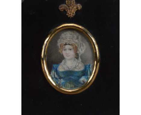 A 19th century Portrait miniature on ivory of a lady, oval in shape, in an ebonised frame with acorn loop mount, work size 7.