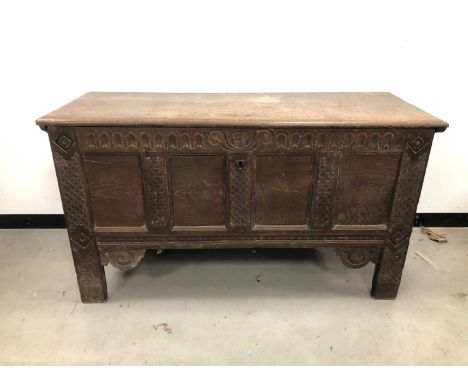 A 18th century and later oak coffer, lift open top with metal hinges, four panel front, 1743 and MB engraved to the front, on