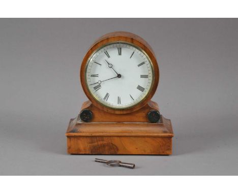 A small early 20th century mantle clock, the white dial with Roman numerals, with a mahogany case, key present 17cm H x 15cm 
