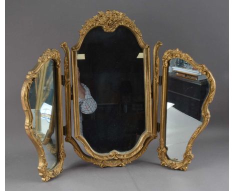 A triple framed dressing table mirror, gold painted frame, in the rococo style, 65cm high