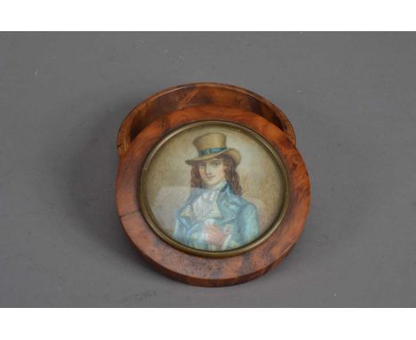 A Georgian Portrait miniature on ivory of a man, in a top hat and teal coat, inset into the cover of  a possibly later wooden