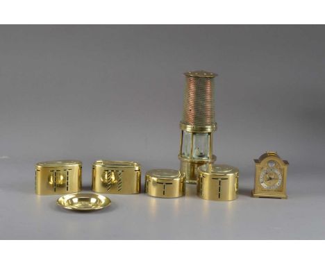 Four mid 20th century brass saving boxes, for differing banks, including Midland bank and Barclays bank, the largest, 5.5cm h