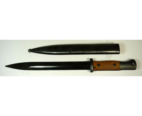 A German bayonet with wood grip and metal scabbard, having straight, fullered single edge blade stamped 9802 y, the scabbard 