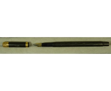 A Swan fountain pen in slim dark case the lid with decorative gilt metal finial
