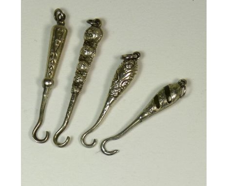 Four small all silver button hooks all with decorative handles (4)