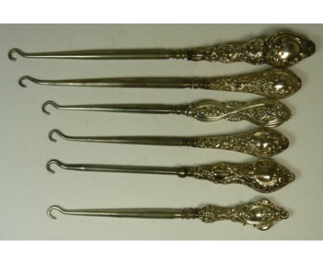 Six late Victorian and Edwardian button hooks with decorative silver handles (6)