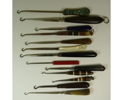 A silver mounted cows horn handled button hook together with 12 other assorted button hooks (13)