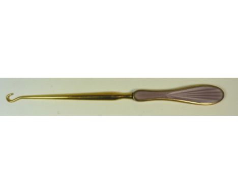 A 9ct gold mounted and lilac enamelled handled button hook with guilloche decoration and gilt metal shaft ++good condition