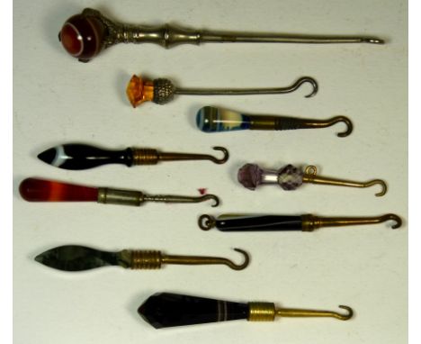 A small Victorian button hook with faceted moss agate handle together with seven other small button hooks with agate or hards