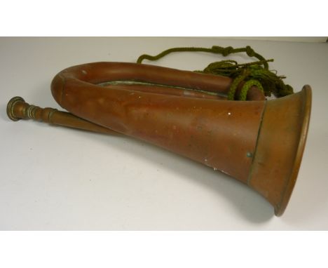 A 1915 US military copper bugle by York & Sons, Grand Rapids, Michigan, USA, and dated 1915, with green lanyard attached, 29c