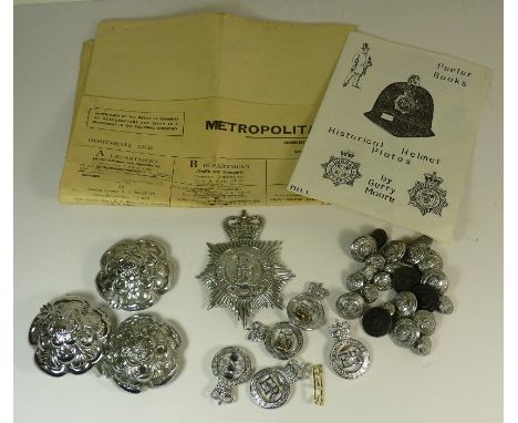 A Warwickshire Constabulary helmet plate; four helmet tops; West Midlands Police badges; mixed police buttons; a Metropolitan