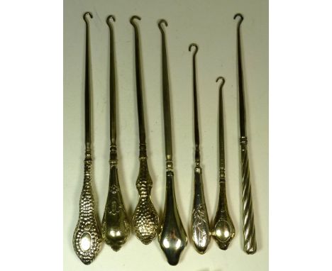 Six large silver handled button hooks (6)