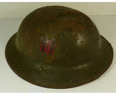 A WWI Canadian metal helmet ++poor