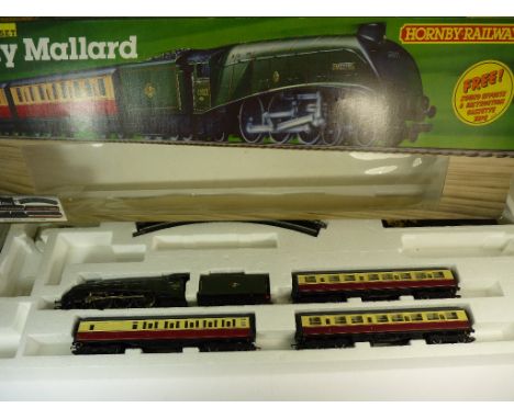 HORNBY - boxed Mighty Mallard containing A4 Mallard, tender, 3 coaches and other items (incomplete) together with a Lima boxe
