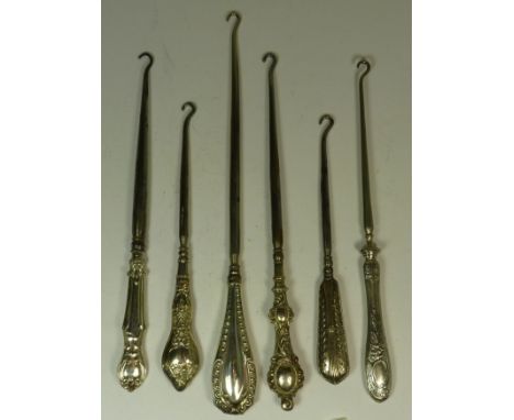 Six late Victorian and early 20th Century button hooks with decorative silver handles (6)