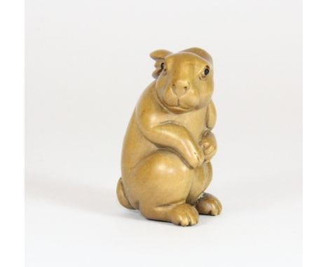 A signed fruitwood netsuke of a rabbit