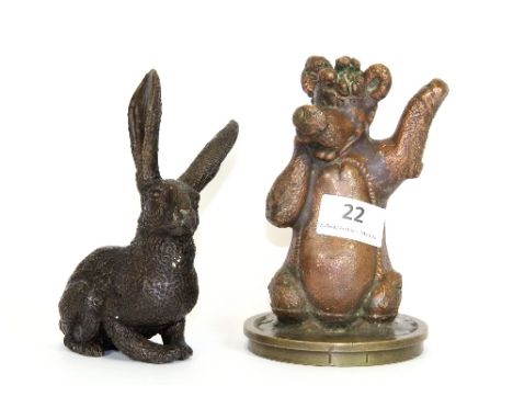 An interesting bronze figure of Baloo (H 15cm), together with a bronze hare