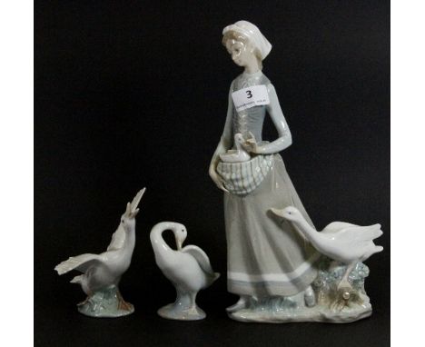 A Lladro figure of a girl with geese and 2 Lladro geese figures