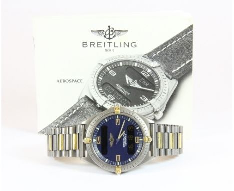 A gents Breitling Titanium and gold coloured gents wristwatch model F56061 with blue quarter 42mm Arabic dial